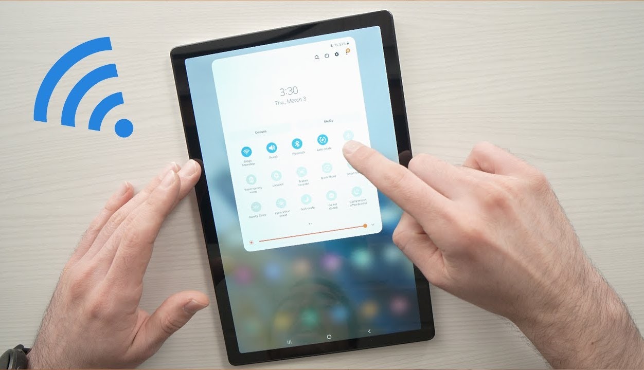 Hands using a tablet with WiFi connection